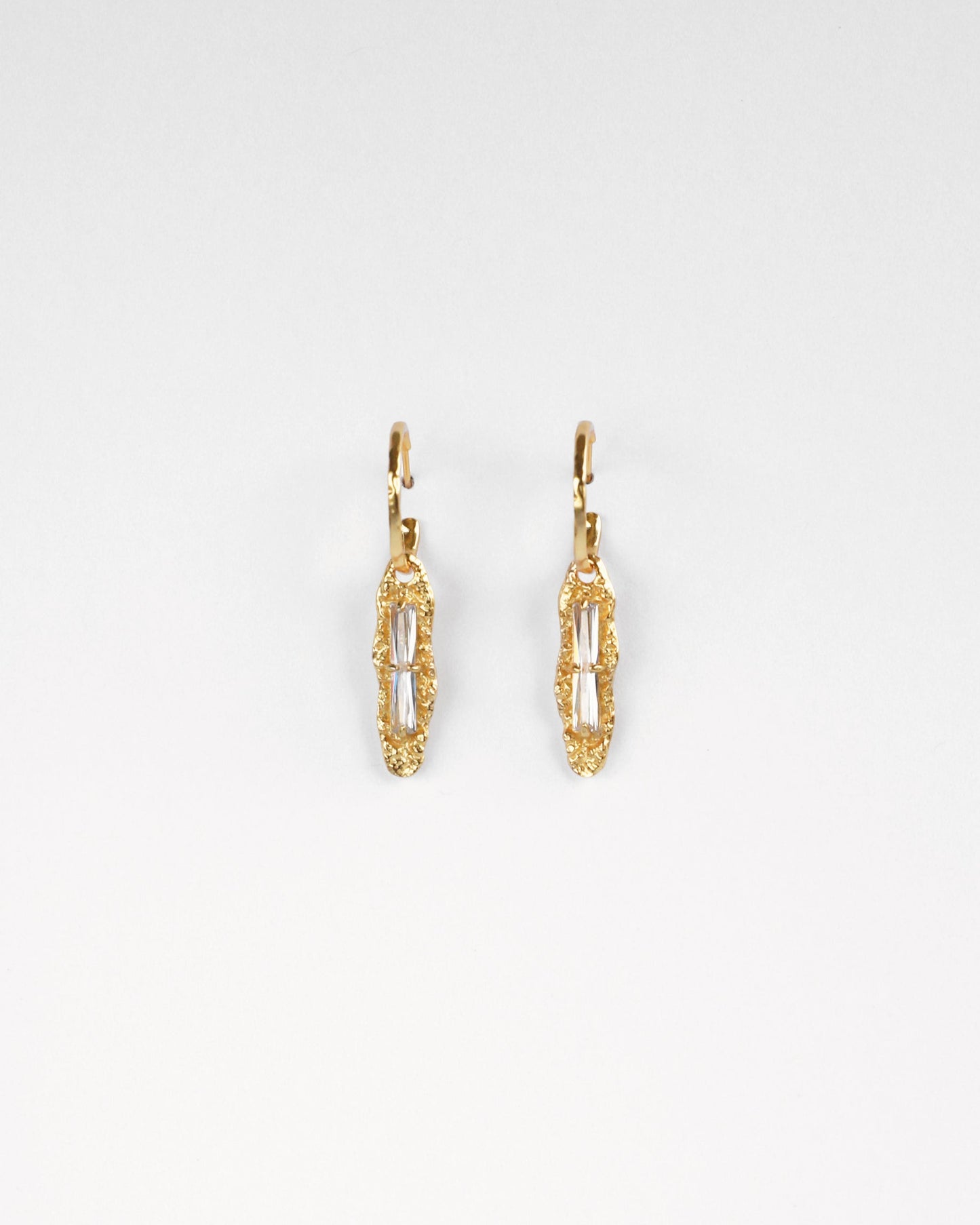 Refined Gleam earrings front view on white background – gold plated sterling silver with white zircon