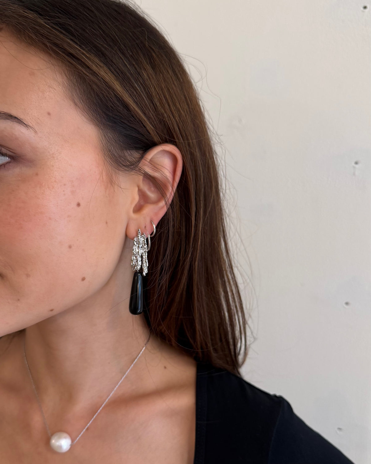 Natural black onyx teardrop earrings with textured gold-plated brass