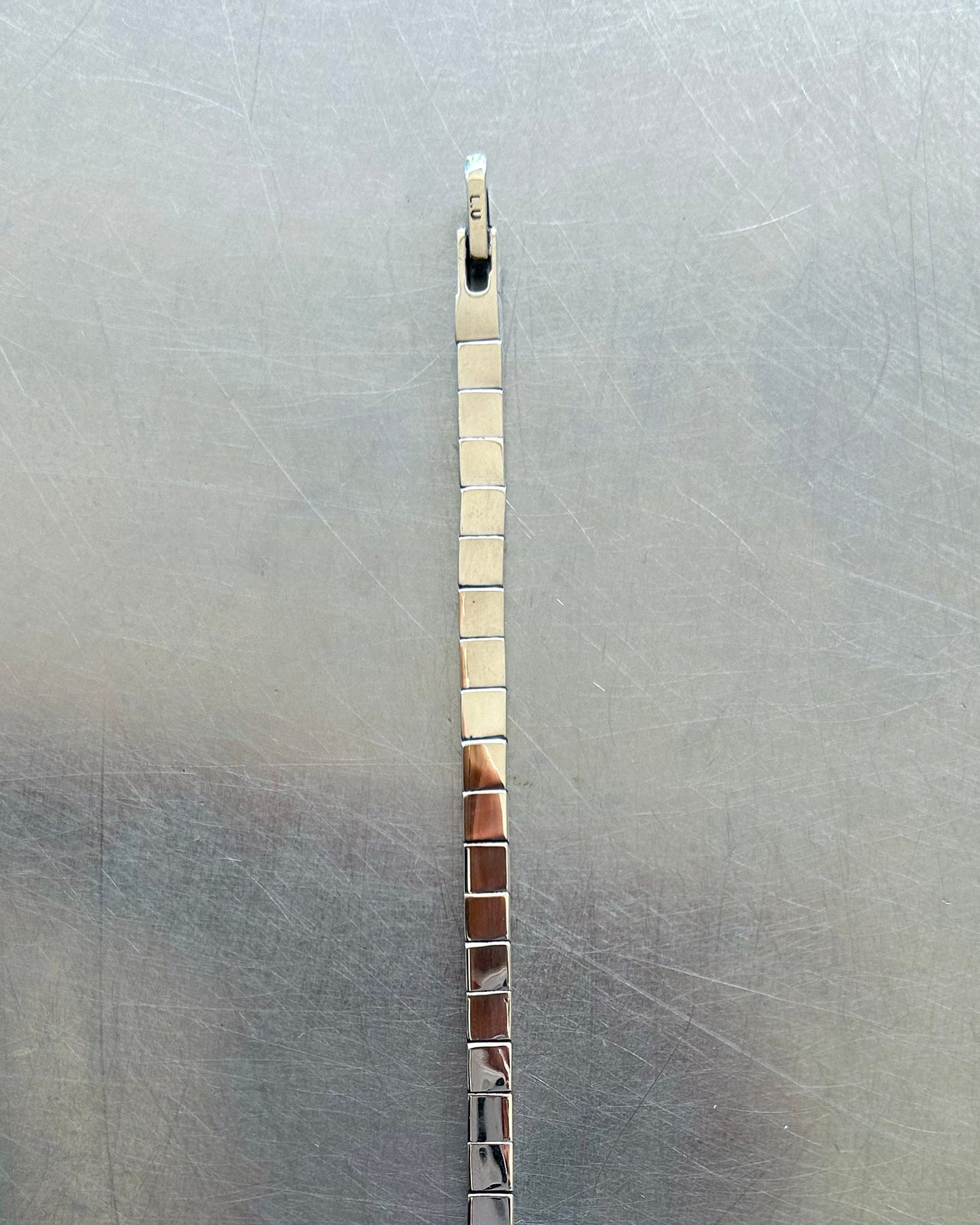 Clasp and chain detail of sterling silver box link necklace
