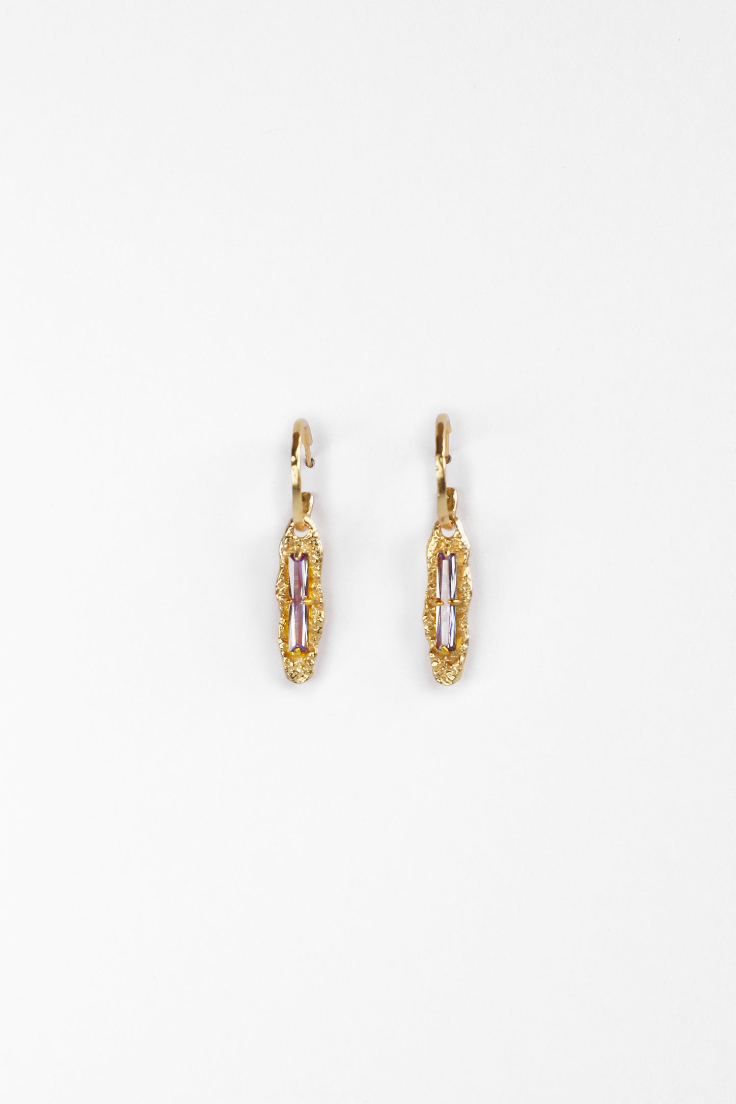 Front view of Twilight Gleam Earrings in 18K gold vermeil with baguette-cut purple zircon stones on sterling silver