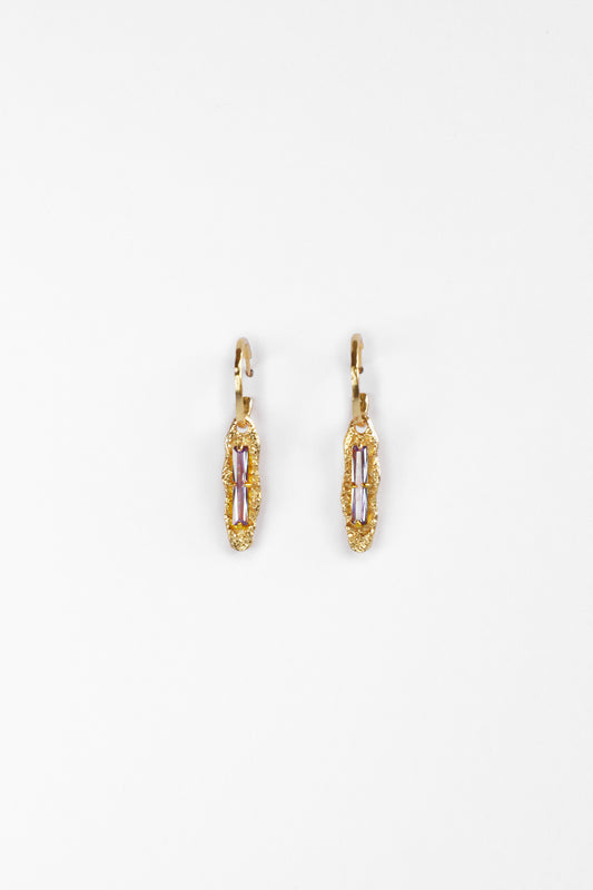 Front view of Twilight Gleam Earrings in 18K gold vermeil with baguette-cut purple zircon stones on sterling silver