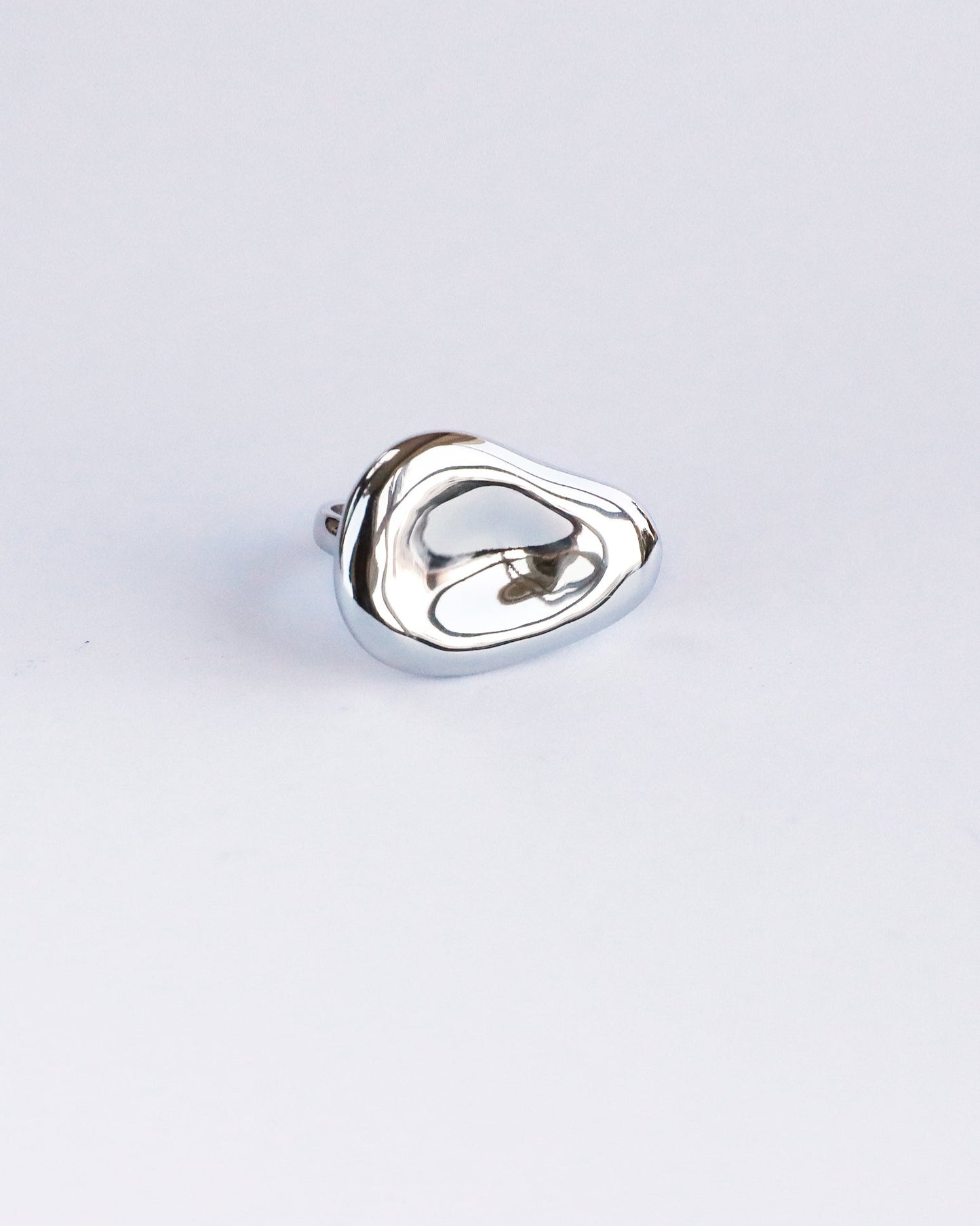 Front view of solid sterling silver dome ring with molten mirror finish, unisex design