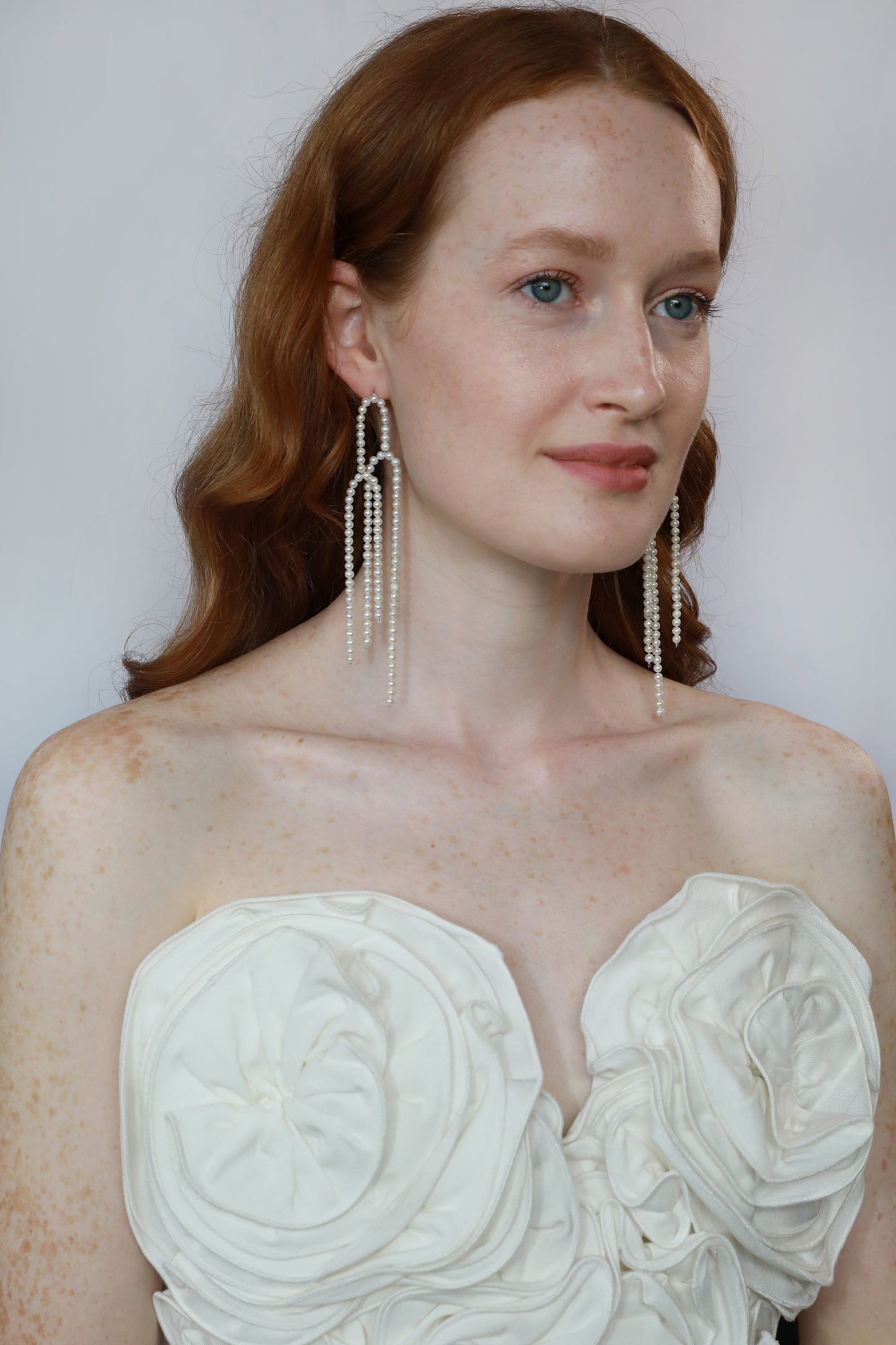 white real natural freshwater pearl long dangle shoulder duster earrings sterling silver silver pushback closure art deco contempary bride wedding model photo