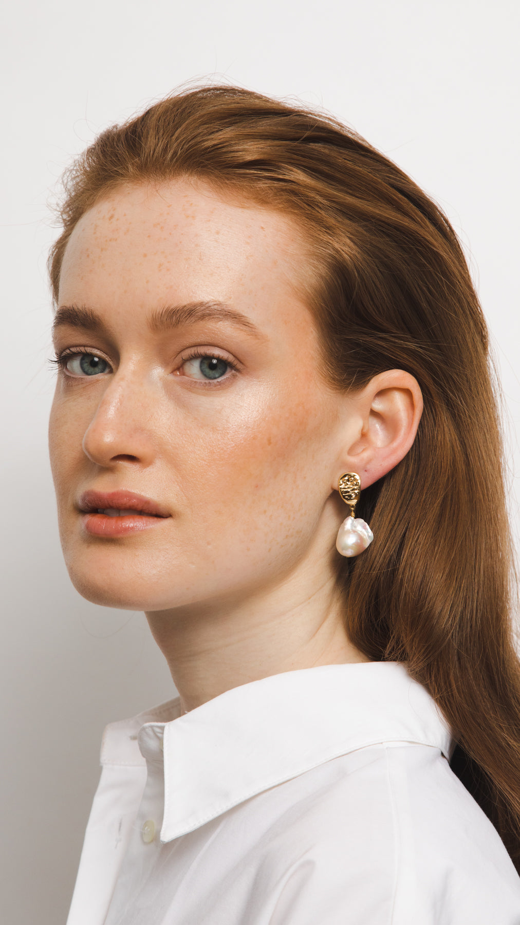 white real natural freshwater baroque pearl hoop huggie earrings gold filled gold pushback closure classic modern bride wedding model photo
