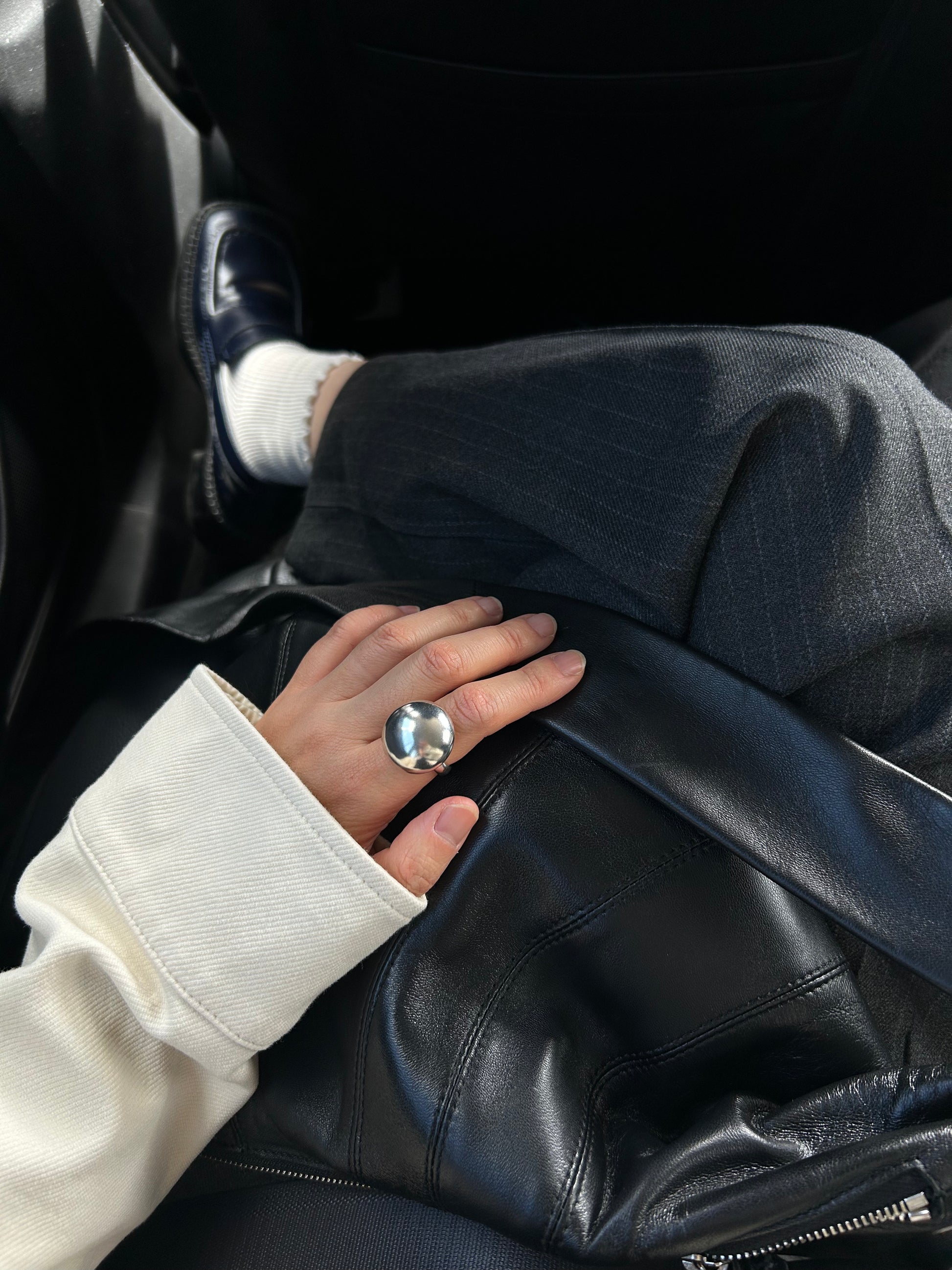 Sculptural silver dome ring with high-shine finish for everyday wear on hand