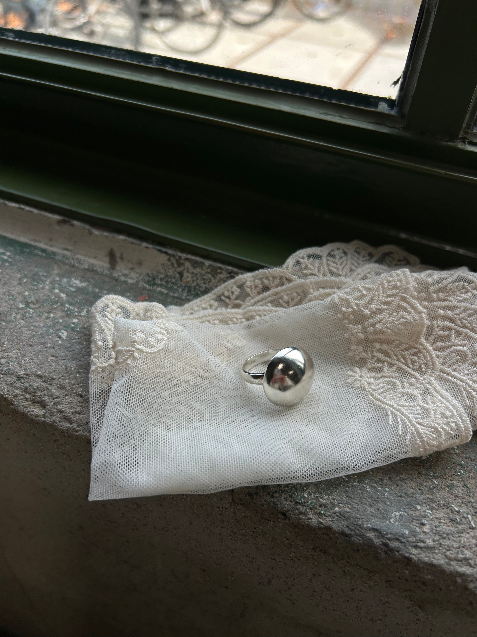 Sculptural silver dome ring with high-shine finish for everyday wear
