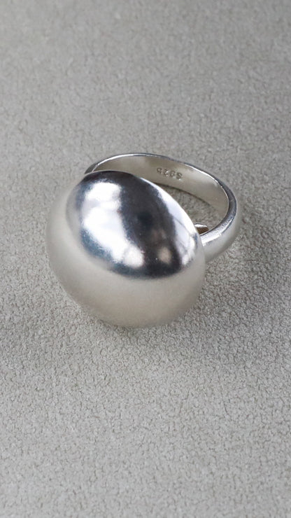 Sculptural silver dome ring with high-shine finish for everyday wear product close up 