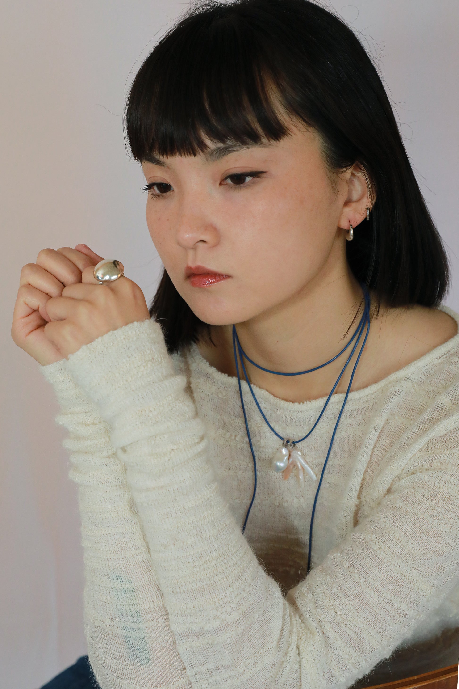 Sculptural silver dome ring with high-shine finish for everyday wear on model
