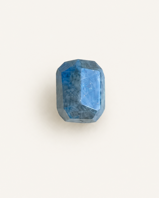 Faceted step-cut lapis lazuli with gold pyrite flecks and white calcite veining