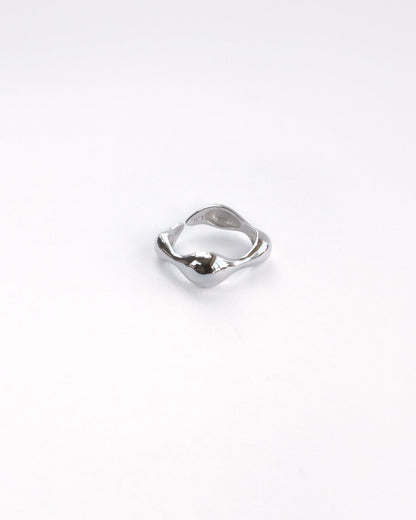 Close-up of polished sterling silver ring with sculptural organic shape – thick version