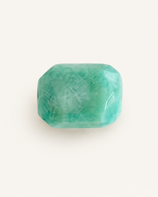 Faceted sea green amazonite showing natural white albite veining