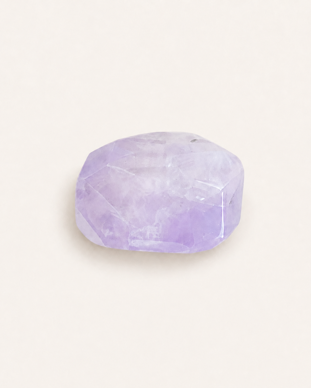 Faceted lilac amethyst cushion cut showing natural colour zoning