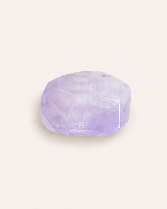 Faceted lilac amethyst cushion cut showing natural colour zoning
