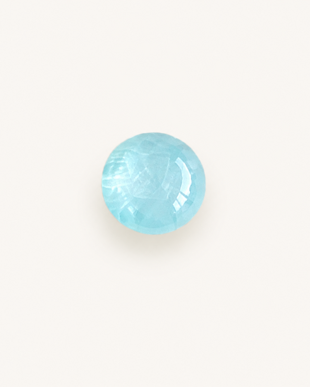 Pale blue aquamarine cabochon with a smooth domed surface