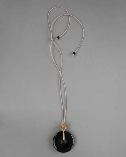 Super long adjustable necklace with polished black onyx pendant, natural picture jasper bead, and beige wax rope cord.