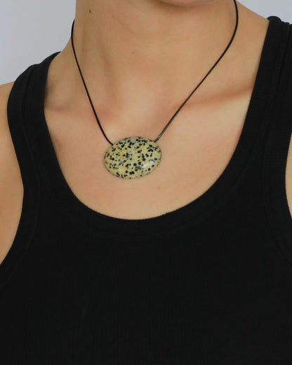 Super long dalmatian jasper pendant necklace with natural black and white spotted stone on adjustable black wax rope cord