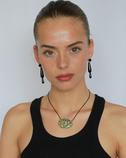 Super long dalmatian jasper pendant necklace with natural black and white spotted stone on adjustable black wax rope cord