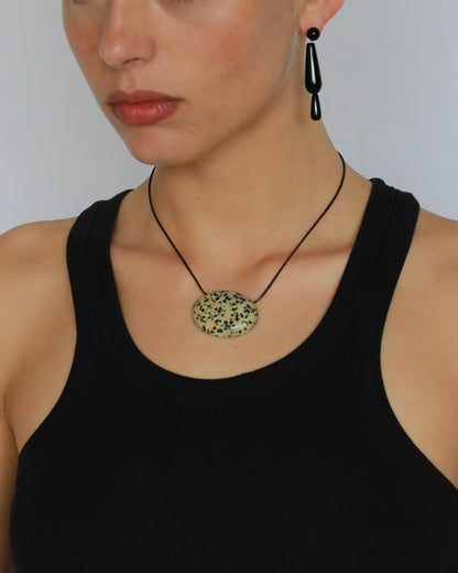 Super long dalmatian jasper pendant necklace with natural black and white spotted stone on adjustable black wax rope cord