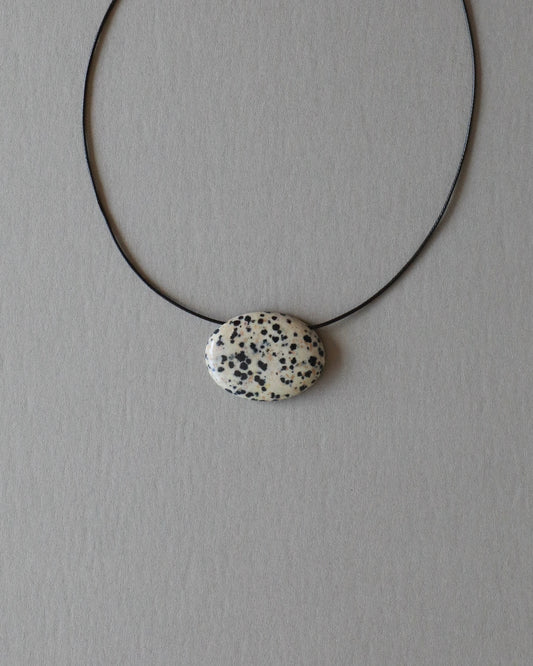 Super long dalmatian jasper pendant necklace with natural black and white spotted stone on adjustable black wax rope cord