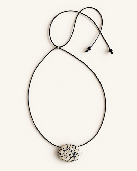 Super long dalmatian jasper pendant necklace with natural black and white spotted stone on adjustable black wax rope cord