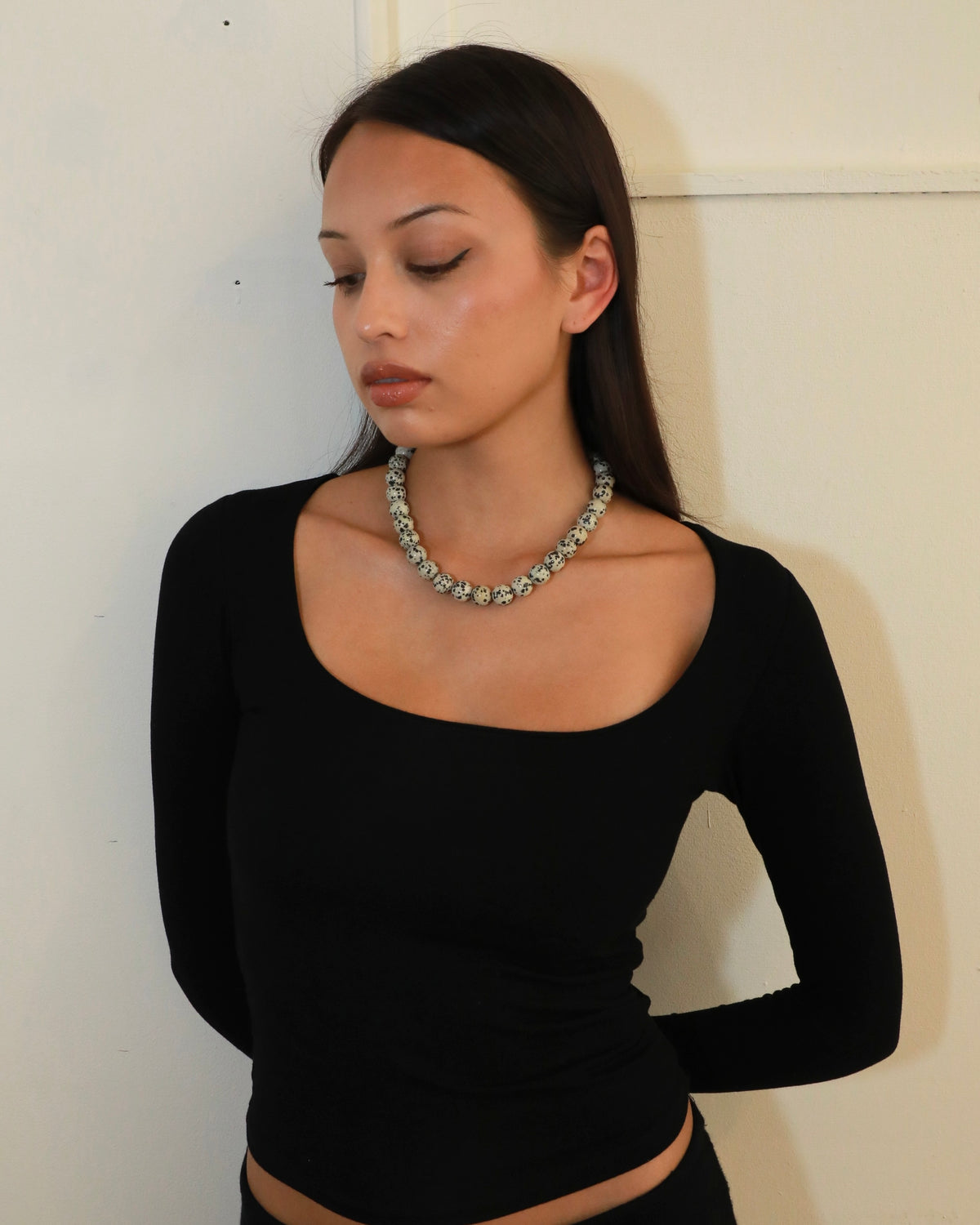 Chunky Dalmatian stone bead necklace with adjustable silver clasp in Nordic minimalist style