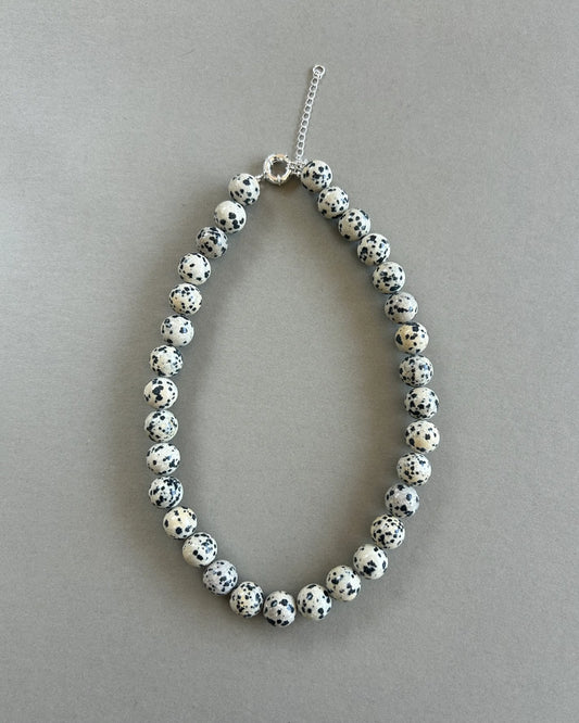 Chunky Dalmatian stone bead necklace with adjustable silver clasp in Nordic minimalist style product photo 
