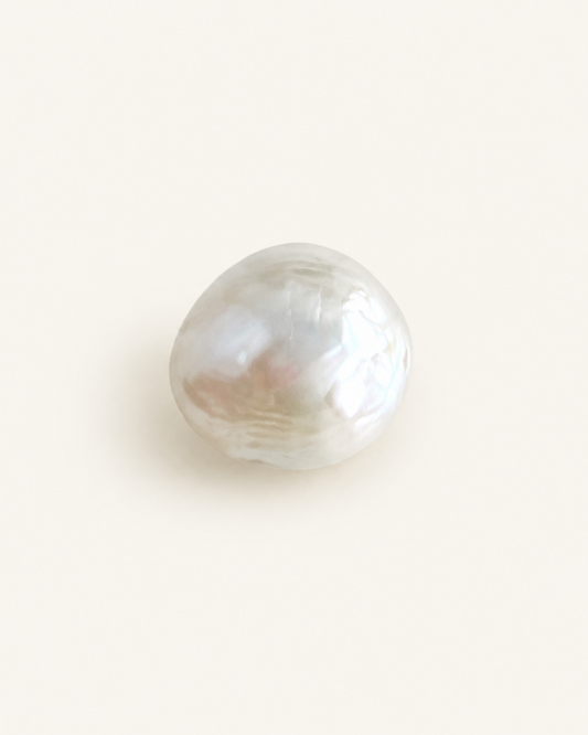 Baroque freshwater pearl with an irregular outline and soft nacre lustre