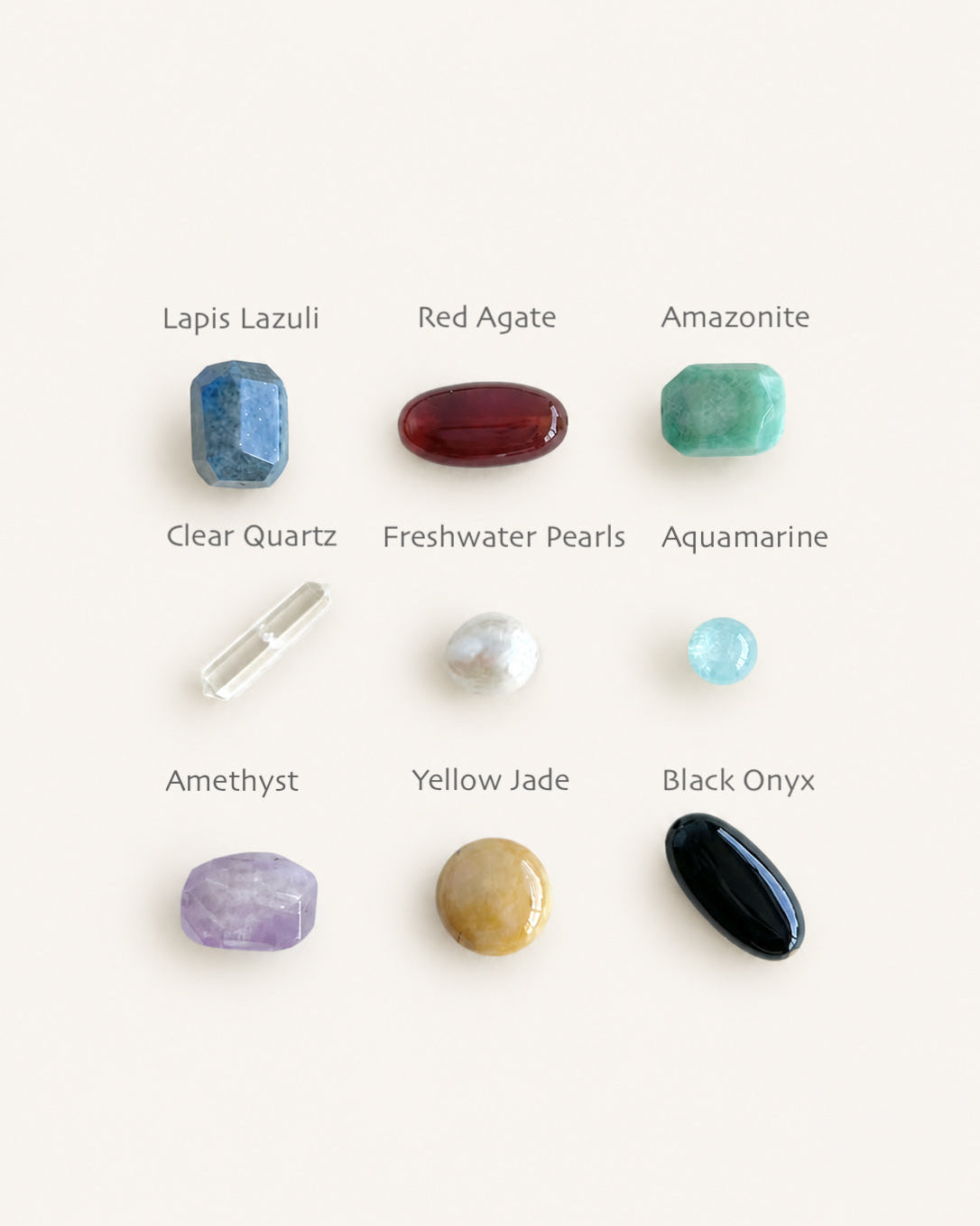 Nine natural gemstones laid in a grid on cream linen, ready to build a necklace