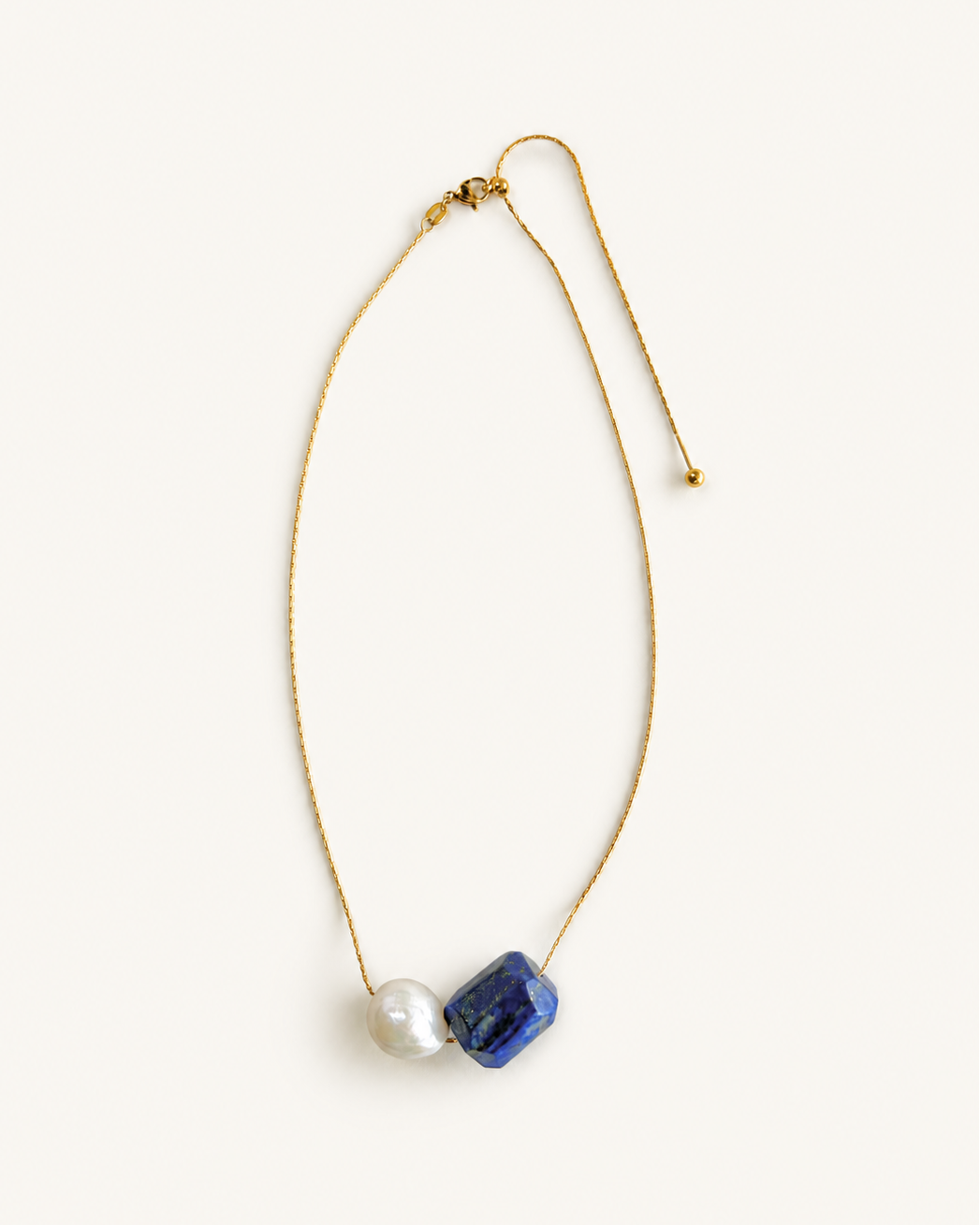 Gold adjustable necklace with natural lapis lazuli stone and large freshwater pearl