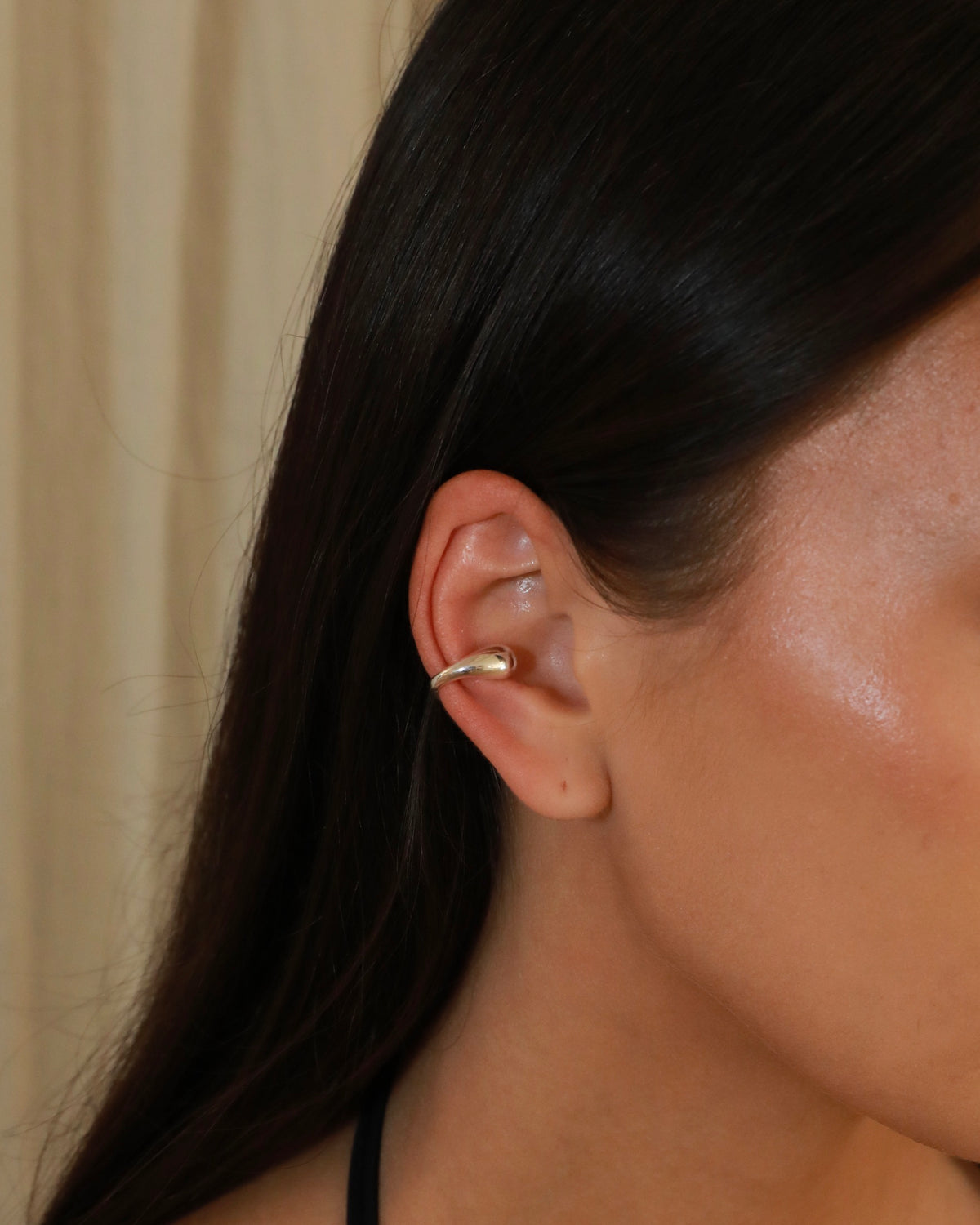 Polished sterling silver ear cuff with an open sculptural design and rounded ends model