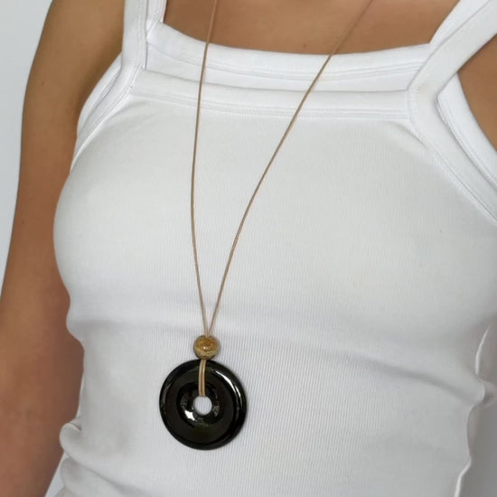 Super long adjustable necklace with polished black onyx pendant, natural picture jasper bead, and beige wax rope cord.