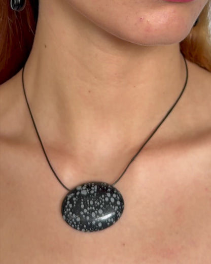 Super long snowflake obsidian pendant necklace with natural black and white speckled stone on adjustable black wax rope cord