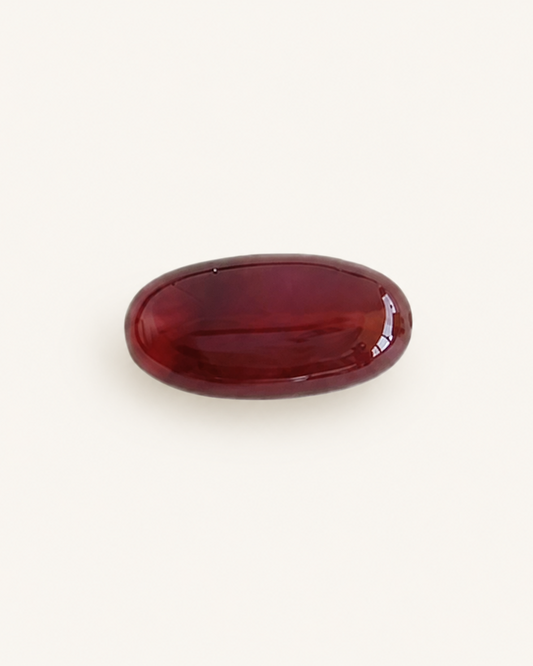 Deep red agate cabochon with a high polished dome catching light