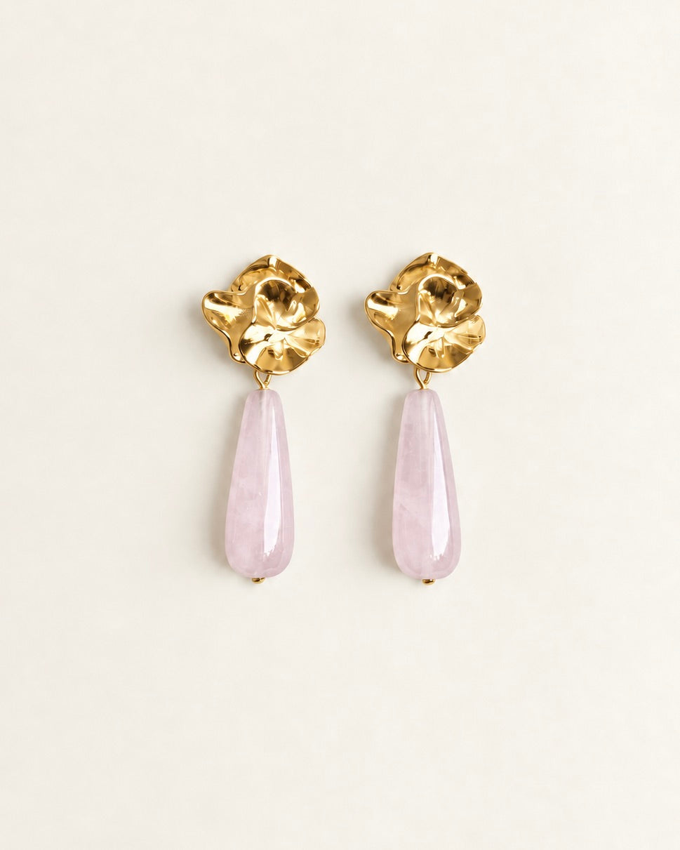 Gold-tone sculptural flower drop earrings with translucent pale rose quartz stones