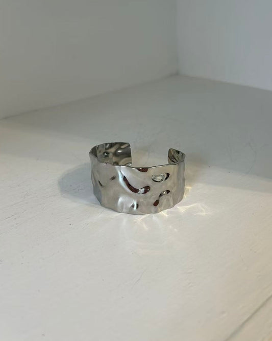 Silver chunky waterproof bangle with natural wavy texture and modern Scandi design

