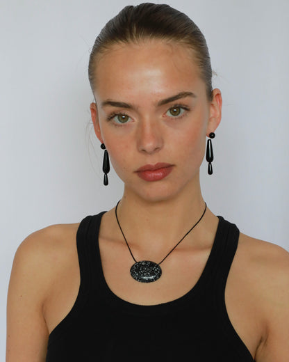 Super long snowflake obsidian pendant necklace with natural black and white speckled stone on adjustable black wax rope cord