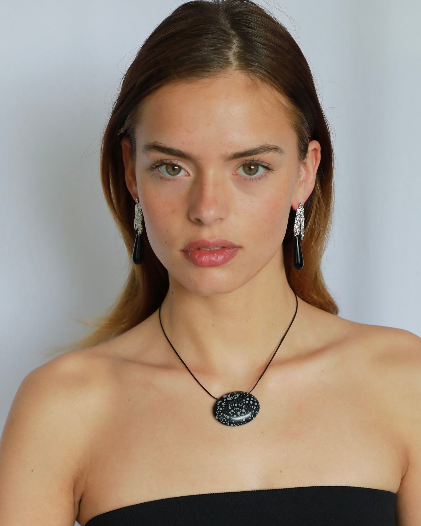 Super long snowflake obsidian pendant necklace with natural black and white speckled stone on adjustable black wax rope cord