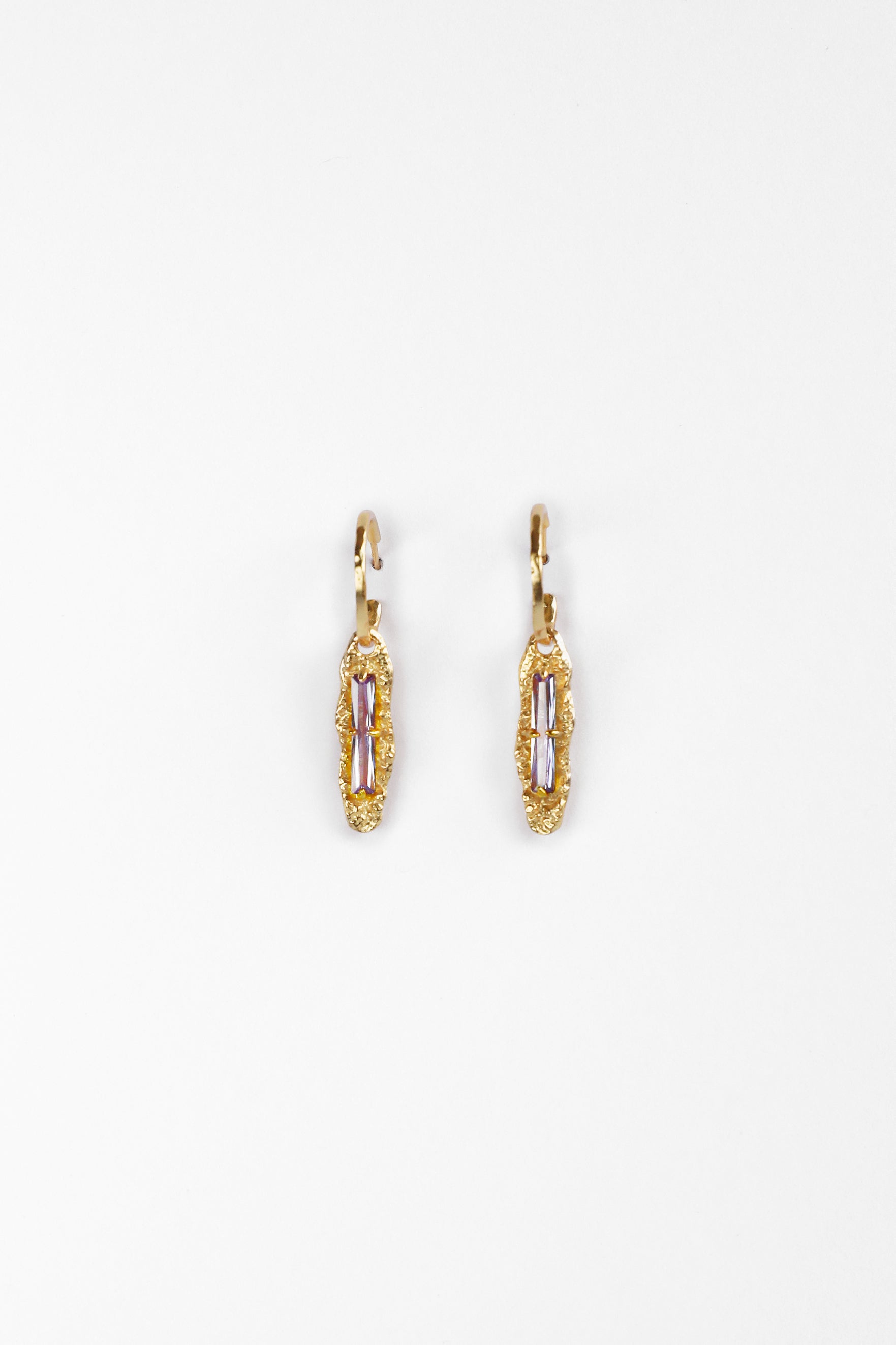 Front view of Twilight Gleam Earrings in 18K gold vermeil with baguette-cut purple zircon stones on sterling silver