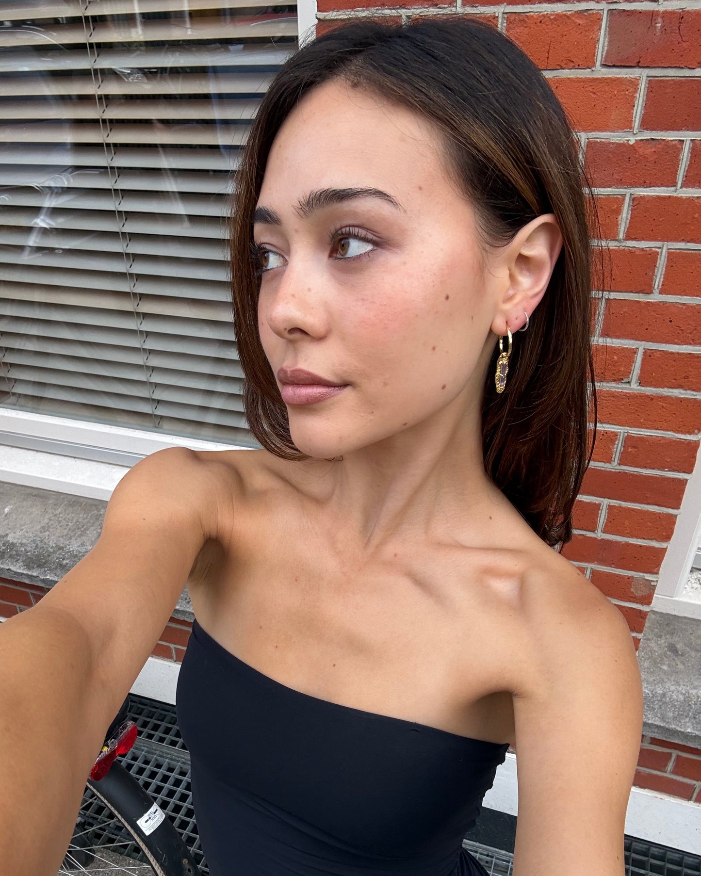 Twilight Gleam gold drop earrings with baguette-cut purple zircon stones, hammered organic pendants and polished gold hoops UGC