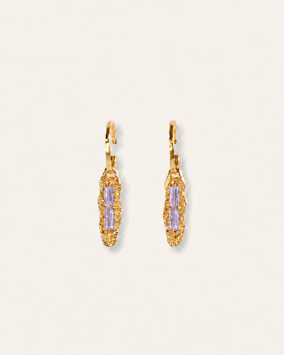 Twilight Gleam gold drop earrings with baguette-cut purple zircon stones, hammered organic pendants and polished gold hoops.
