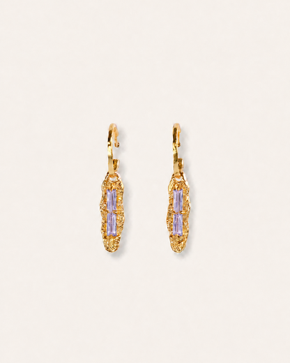 Twilight Gleam gold drop earrings with baguette-cut purple zircon stones, hammered organic pendants and polished gold hoops.