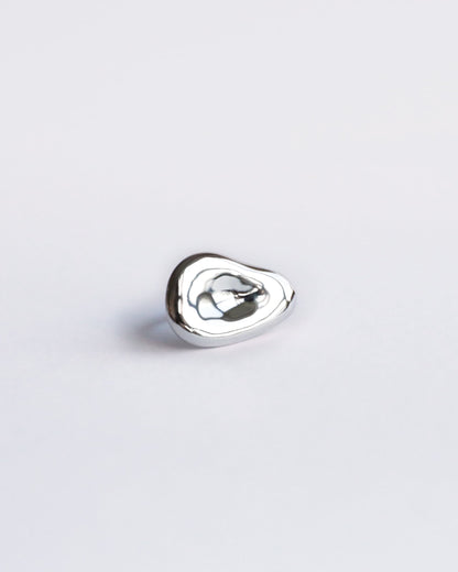 Centered product image of polished sterling silver sculptural ring with organic shape