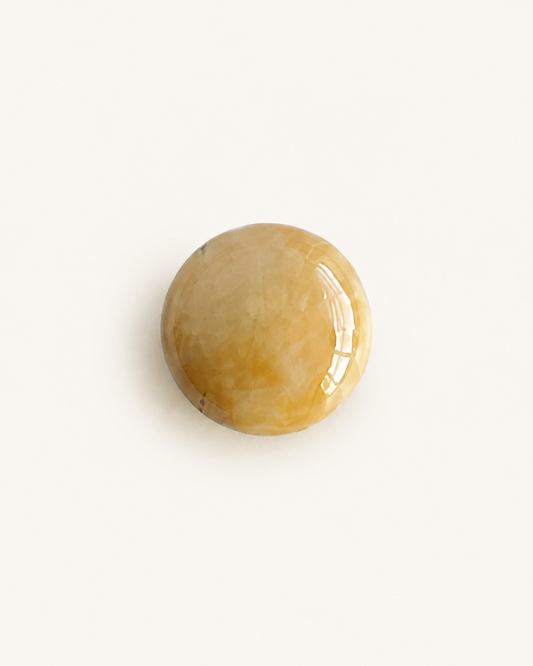 Honey yellow nephrite jade cabochon with a soft waxy polished surface