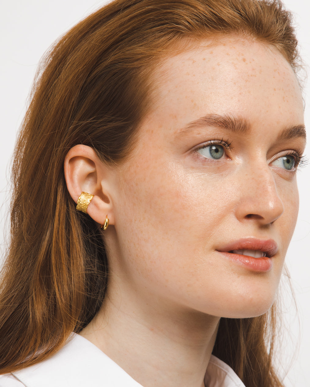 gold adjustable textured ear cuffs for non-pierced ears, nickel-free with an organic sculptural finish