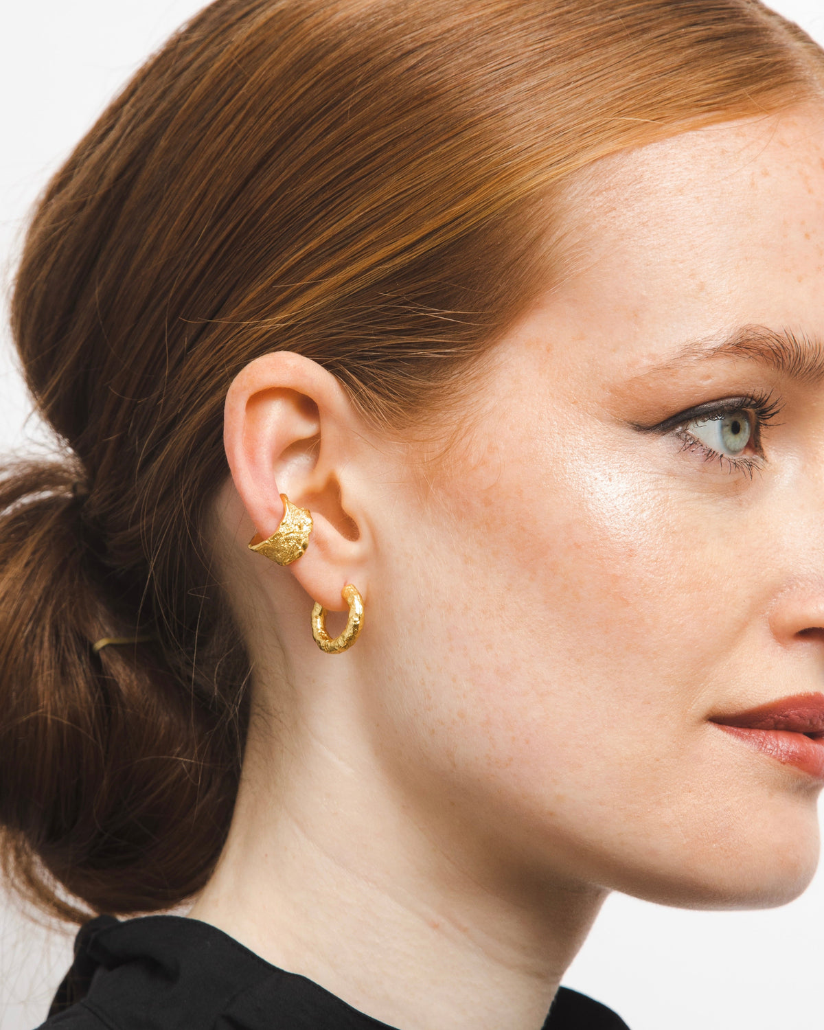 gold adjustable textured ear cuffs for non-pierced ears, nickel-free with an organic sculptural finish.