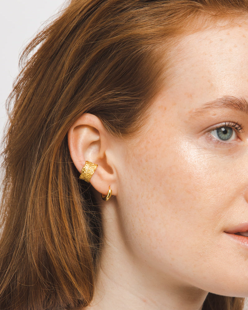 gold adjustable textured ear cuffs for non-pierced ears, nickel-free with an organic sculptural finish.