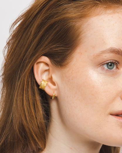 gold adjustable textured ear cuffs for non-pierced ears, nickel-free with an organic sculptural finish.
